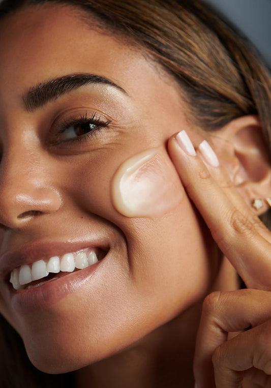 Girl applying Melting Moisture Masque to keep her skin hydrated and nourished.